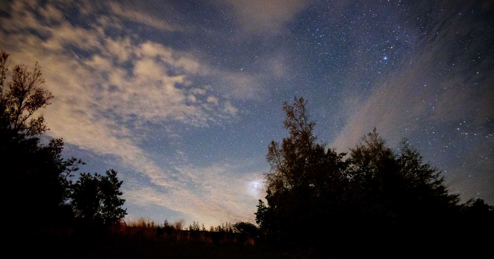 dark starry sky above Grassholme Reservoir 